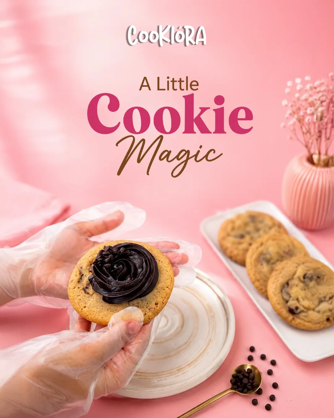 Gloved hands holding a cookie topped with chocolate ganache: a little cookie magic