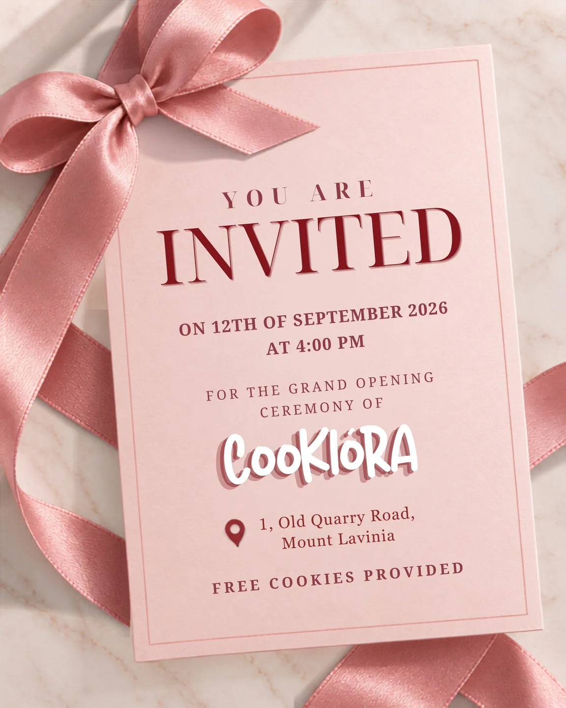 An invitation card with a satin ribbon: you are invited to the grand opening of Cookiora
