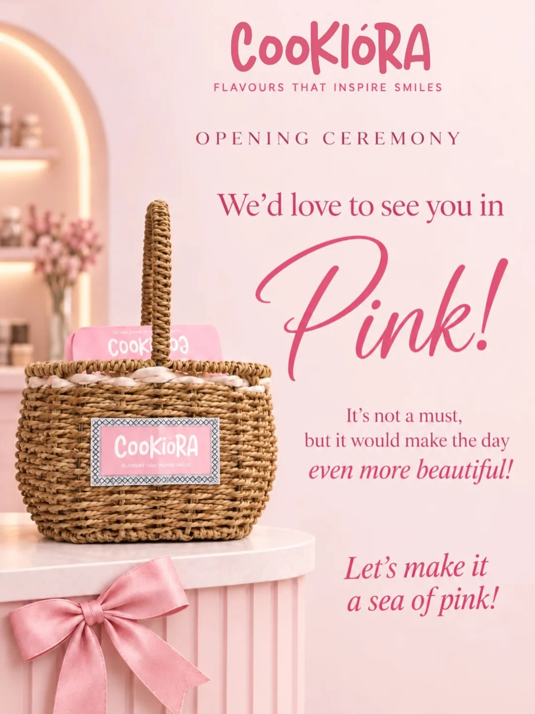 A pink opening ceremony card beside a wicker basket: we'd love to see you in pink